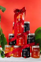 Ten Hapag 280mL jars stacked into a tree with a red ribbon